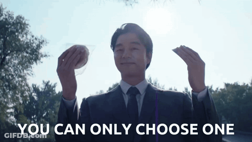 Man In Suit Holding Two Foods You Can Only Choose One GIF