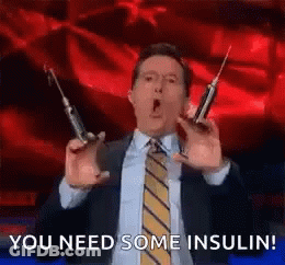 Man In Suit Holding Two Syringes Saying You Need Some Insulin GIF