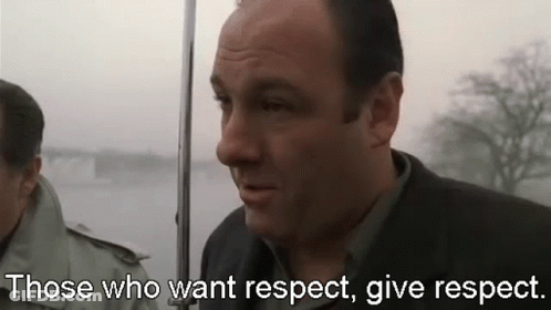 Man In Suit Holding Umbrella Saying Respect GIF