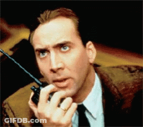 Man In Suit Holding Walkie Talkie GIF