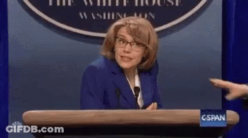Man In Suit Holding Water Gun At Podium Saying This Is Soapy Water GIF