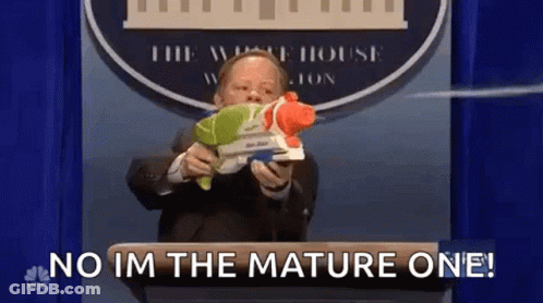 Man In Suit Holding Water Gun Saying No I'm The Mature One GIF
