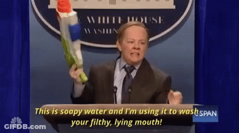 Man In Suit Holding Water Gun Saying This Is Soapy Water GIF