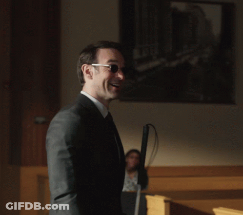 Man In Suit Holding White Cane GIF