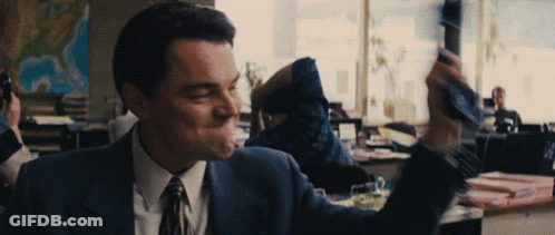 Man In Suit Holding Wine GIF