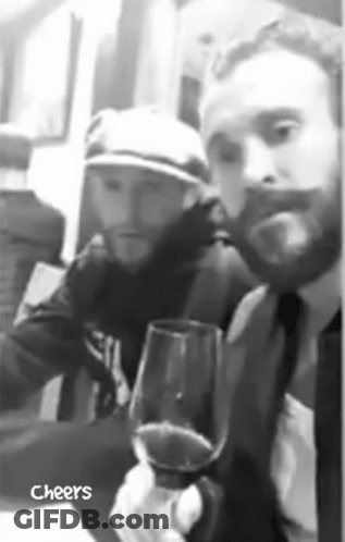 Man In Suit Holding Wine With Hat Man GIF