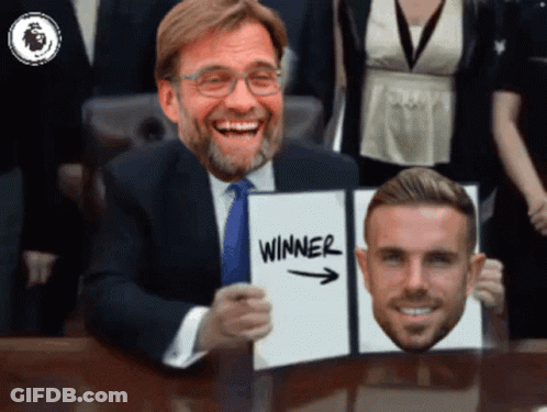 Man In Suit Holding Winner Sign GIF