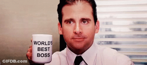 Man In Suit Holding World's Best Boss Cup GIF