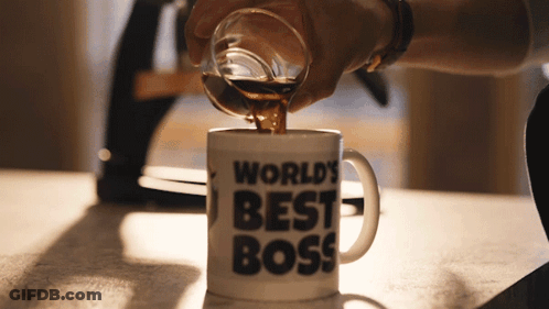 Man In Suit Holding World's Best Boss Mug GIF