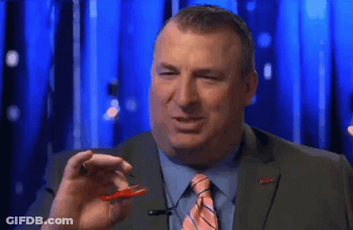 Man In Suit Holding Worm GIF