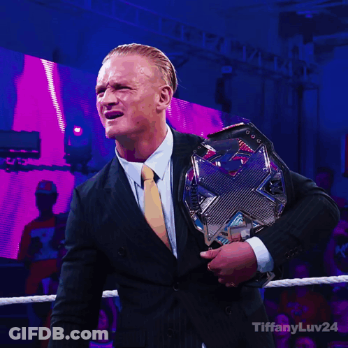 Man In Suit Holding Wrestling Championship GIF