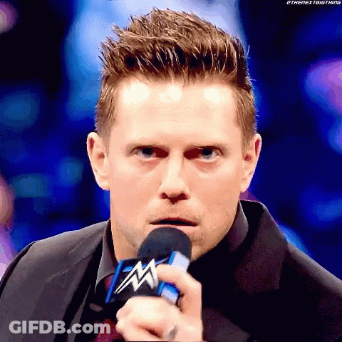 Man In Suit Holding WWE Microphone GIF