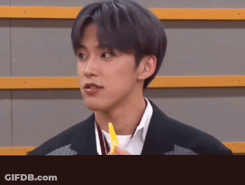 Man In Suit Holding Yellow Pen GIF