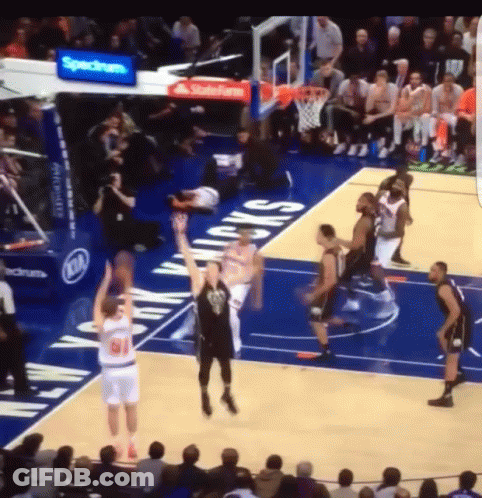 Man In Suit Hugging Another Man In Front Of Flags 2014-2022 GIF