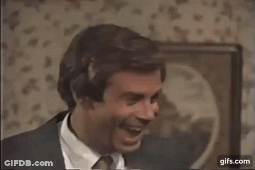 Man In Suit Hugging Another Man In Room GIF