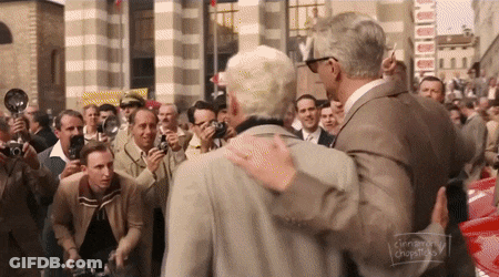 Man In Suit Hugging Man Crowd Cinnamon Chopsticks GIF