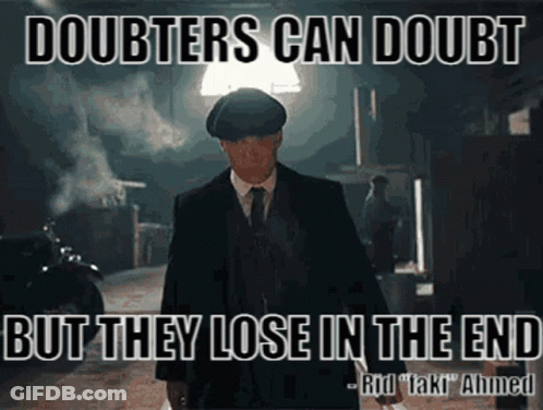 Man In Suit In Dark Alleyway Quote About Doubters GIF