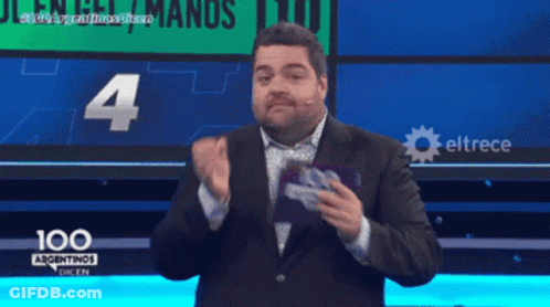 Man In Suit In Front Of 100 Argentinas Sign GIF