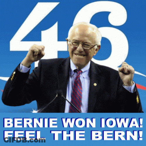 Man In Suit In Front Of Bernie Won Iowa Feel The Bern Sign GIF