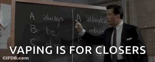 Man In Suit In Front Of Blackboard Saying Vaping Is For Closers GIF