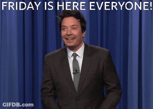 Man In Suit In Front Of Blue Curtain Saying Friday Is Here Everyone GIF