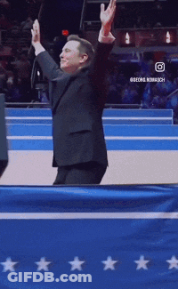 Man In Suit In Front Of Blue Star Flag GIF