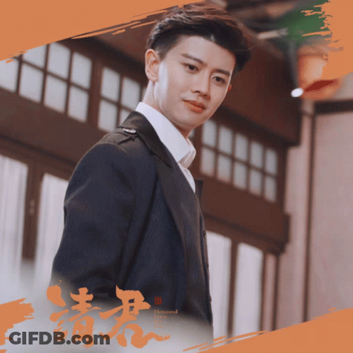 Man In Suit In Front Of Building GIF