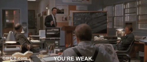 Man In Suit In Front Of Chalkboard Saying September Sales GIF