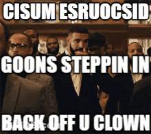 Man In Suit In Front Of Crowd Saying Goons Steppin GIF