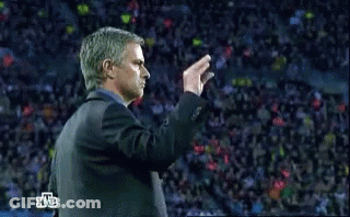 Man In Suit In Front Of Crowd With Letters HB GIF