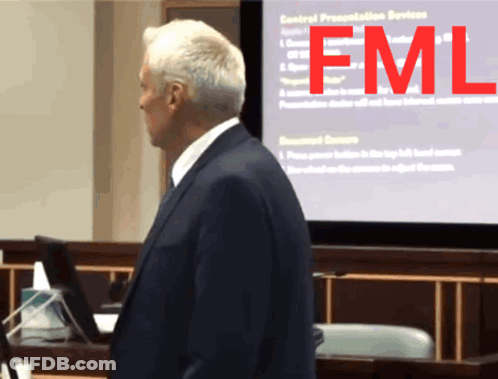 Man In Suit In Front Of FML Screen GIF