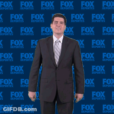 Man In Suit In Front Of Fox Deportes Wall GIF