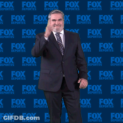 Man In Suit In Front Of Fox Deportes Wall GIF