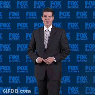 Man In Suit In Front Of Fox Deportes Wall GIF