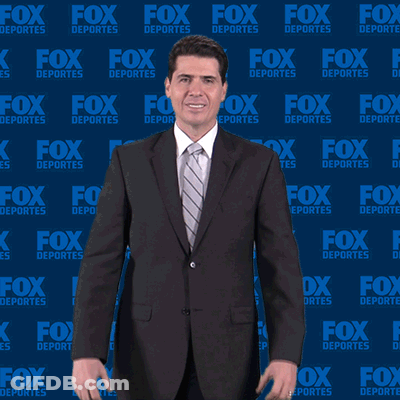 Man In Suit In Front Of Fox Deportes Wall GIF