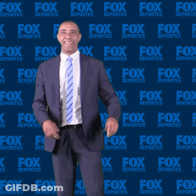 Man In Suit In Front Of Fox Deportes Wall GIF