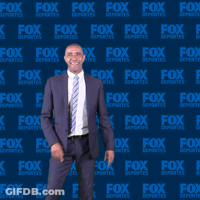 Man In Suit In Front Of Fox Deportes Wall GIF
