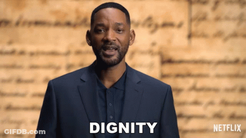 Man In Suit In Front Of Netflix Logo GIF