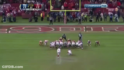 Man In Suit In Front Of NFL Draft Wall GIF