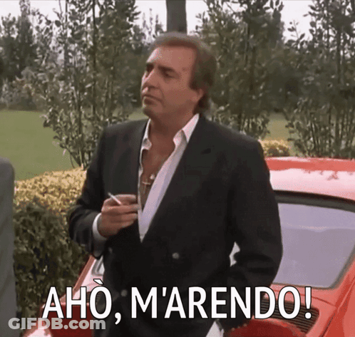 Man In Suit In Front Of Red Car Aho Marendo GIF