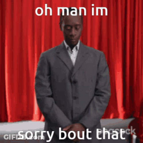 Man In Suit In Front Of Red Curtain Saying Oh Man Im Sorry Bout That GIF