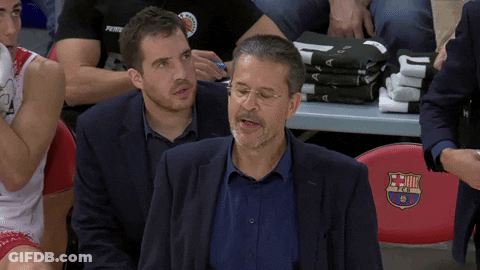 Man In Suit In Front Of Red FC Barcelona Seat GIF