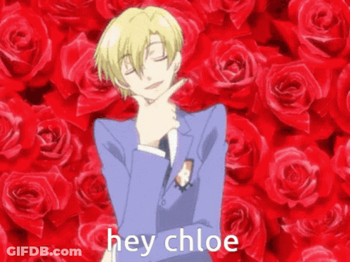 Man In Suit In Front Of Red Roses With Hey Chloe Below GIF