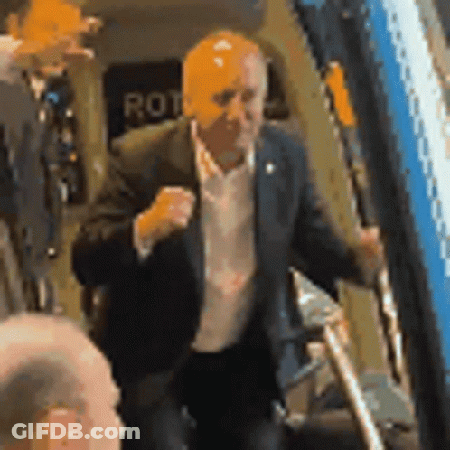 Man In Suit In Front Of Rot Sign GIF
