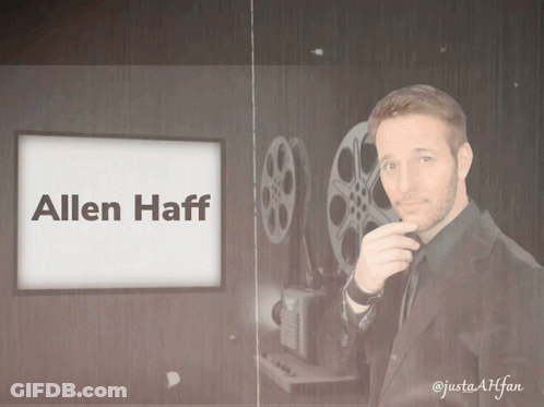 Man In Suit In Front Of Screen Saying Allen Haff GIF