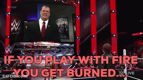 Man In Suit In Front Of Screen Saying If You Play With Fire You Get Burned GIF