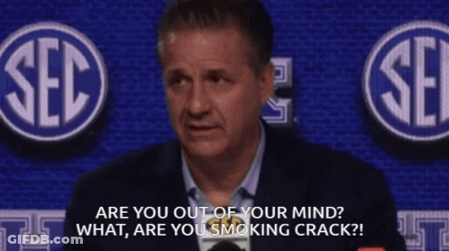 Man In Suit In Front Of SEC Logo GIF
