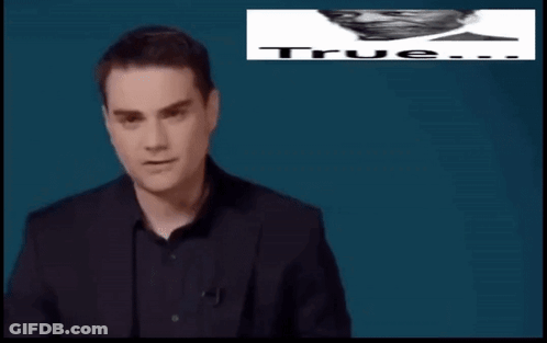 Man In Suit In Front Of Sign Saying True Don't Care About Your GIF