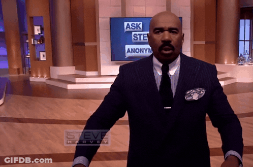 Man In Suit In Front Of Steve Harvey Screen GIF
