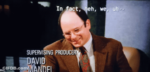 Man In Suit In Front Of Supervising Producer David Mandl GIF